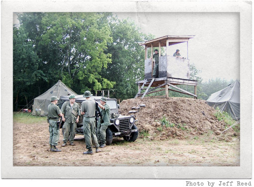 Troops, jeep, and the firebase tower
